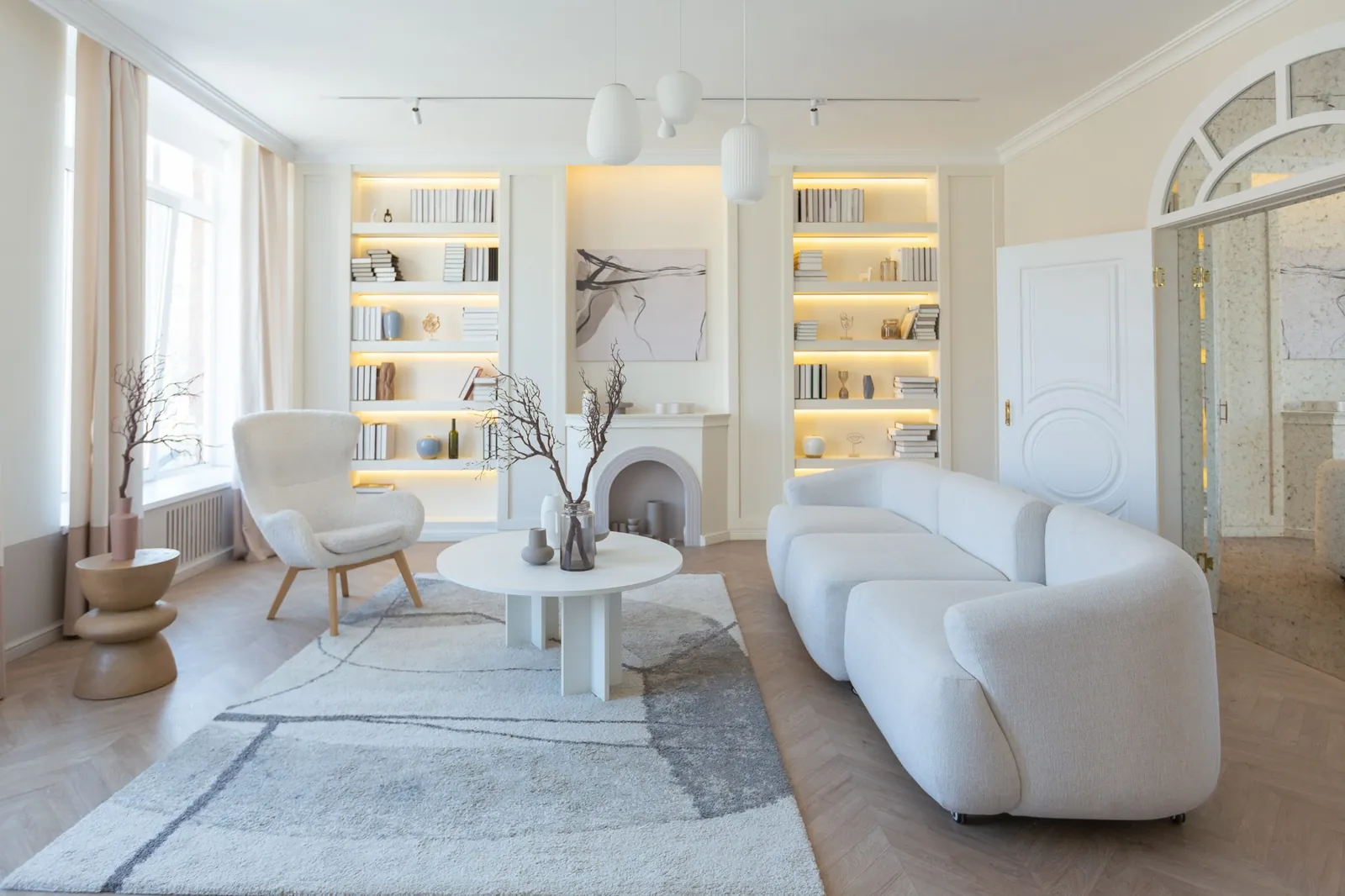 An elegant, bright living room, fully furnished and styled, ready to move in
