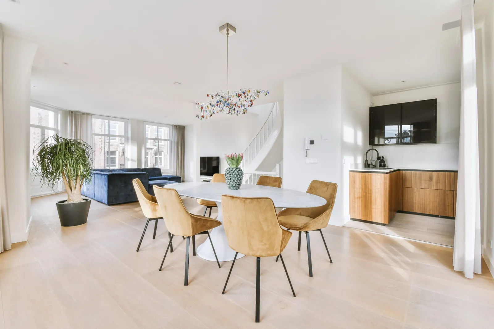 A bright open-plan living and dining room, ready to welcome guests